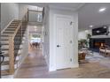 Bright entryway with hardwood floors, staircase, and view into living area at 1461 Milford N Ct, Marietta, GA 30008