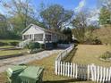 Cute bungalow with a white picket fence and spacious yard at 25 Johnson Rd, Atlanta, GA 30318