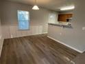 Bright dining area with wood-look flooring and built-in shelving at 309 Hemphill School Nw Rd, Atlanta, GA 30331