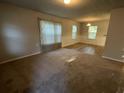 Spacious living room with carpeted floors and lots of natural light at 309 Hemphill School Nw Rd, Atlanta, GA 30331