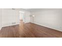 Living room featuring hardwood floors and access to other rooms at 6520 Roswell Rd # 106, Atlanta, GA 30328