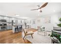 Open concept kitchen with gray cabinets, island, and stainless steel appliances at 996 Longleaf Dr, Forest Park, GA 30297