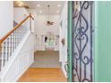 Bright and airy entryway with hardwood floors and staircase at 4522 Howell Farms Rd, Acworth, GA 30101