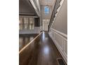 Elegant foyer with hardwood floors and wainscoting at 2450 China Berry Ln, Powder Springs, GA 30127