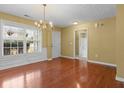 Dining room with hardwood floors and chandelier at 2457 Swan Lake Dr, Grayson, GA 30017