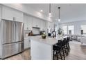 Modern kitchen with white cabinets, an island, and stainless steel appliances at 1033 Division Nw St # 33, Atlanta, GA 30318