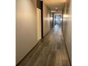 Clean and well-lit hallway with wood-look floors at 870 Mayson Turner Nw Rd # 1110, Atlanta, GA 30314