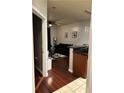 Open living area with dark couch and hardwood floors at 870 Mayson Turner Nw Rd # 1110, Atlanta, GA 30314