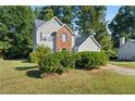 Two-story house with gray siding, brick accents, and a two-car garage at 3362 Eastmont Ln, Lithonia, GA 30038