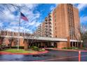 Brick building exterior with landscaping and flag at 300 Johnson Ferry Ne Rd # B413, Atlanta, GA 30328