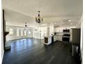 Open concept living room and kitchen with modern finishes at 3571 Quail Hollow Trl, Snellville, GA 30039