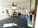 Open concept living area with kitchen and fireplace at 3571 Quail Hollow Trl, Snellville, GA 30039