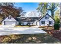 Charming white brick ranch home with landscaping and a large yard at 450 Shadowlawn Se Rd, Marietta, GA 30067