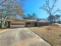 Brick ranch house with attached garage and carport at 2931 Randolph Ne Ct, Conyers, GA 30012