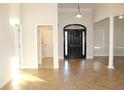 Spacious entryway with tile floors and arched doorway at 321 Whitney Ln, Mcdonough, GA 30253