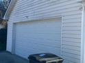 White vinyl-sided garage with a white door at 240 Skyland Dr, Loganville, GA 30052