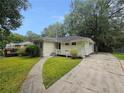 House exterior showcasing a large yard and driveway at 2103 Mcafee Rd, Decatur, GA 30032