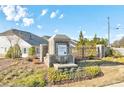 Aspen Grove community entrance with brick pillars and a wrought iron gate at 2678 Songbird Ln, Grayson, GA 30017