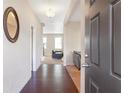 Dark hardwood floors and an open view into the living area at 2070 Bonny Glen Cir, Austell, GA 30106