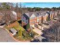 Townhome community with lush green spaces and convenient parking at 5565 Trace Views Dr, Norcross, GA 30071