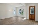 Spacious dining room with hardwood floors and a chandelier at 114 Terrace Ne Dr, Atlanta, GA 30305