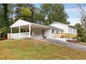 Charming ranch home with covered porch and driveway at 2089 Bluffton Way, Decatur, GA 30035