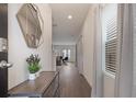 Bright entryway with hardwood floors and a view into the living room at 3135 Hendrick Dr, Mcdonough, GA 30253