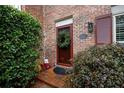 Inviting front entrance with brick walkway and festive decor at 323 The Chace Ne, Sandy Springs, GA 30328