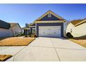 Charming blue home with white accents and a two-car garage at 405 Laurel Spring Ct, Canton, GA 30114