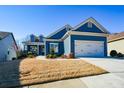 Charming blue home with white accents and a two-car garage at 405 Laurel Spring Ct, Canton, GA 30114