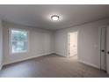 Spacious bedroom with carpet and neutral walls at 1086 Hawthorn Ct, Loganville, GA 30052