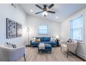 Bright living room with comfy seating and large windows at 116 Turman Se Ave, Atlanta, GA 30315