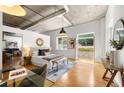 Bright bedroom with hardwood floors and access to a private balcony at 206 11Th St # 302, Atlanta, GA 30309