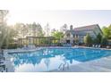 Community pool with lounge chairs and clubhouse at 237 Laurel Vista Dr, Canton, GA 30114