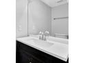 Bathroom boasts a modern vanity with a white countertop at 731 Victoria Sw Pl, Atlanta, GA 30310