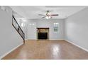 Spacious living room featuring tile floors and a fireplace at 731 Victoria Sw Pl, Atlanta, GA 30310