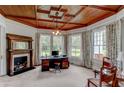 Spacious home office featuring hardwood floors, built-in shelving, and a fireplace at 788 S Hwy 11 S, Social Circle, GA 30025