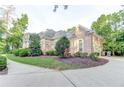 Brick home with walkway and landscaping at 25 Inverleigh Row, Covington, GA 30014