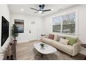 Bright living room featuring a comfy sofa and large windows at 1288 Almont Sw Dr, Atlanta, GA 30310