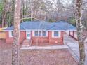 Ranch house with a spacious yard and detached building at 3150 Humphries Se Dr, Atlanta, GA 30354