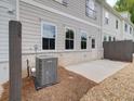 Private patio and fenced backyard with gravel and AC unit at 747 Trevett Way, Marietta, GA 30062