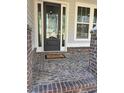 Dark gray front door with sidelights and a welcoming mat at 3780 Chattahoochee Lot 32 Rd, Cumming, GA 30041