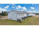 Aerial view of townhomes showcasing private backyards and fences at 1112 Edinberg Dr # 57, Villa Rica, GA 30180