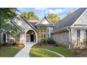 Brick house exterior showcasing a two-story home with a large front yard at 129 Talon Pl, Mcdonough, GA 30253
