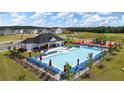 Community pool with a clubhouse, playground, and lounge chairs at 532 Vervain Drive, Locust Grove, GA 30248