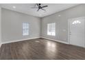 Bright and airy living room with dark hardwood floors and neutral walls at 1794 Spring Ne St, Conyers, GA 30012
