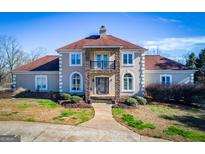 Two-story house with stone accents and balcony at 525 Oak Mountain Rd, Carrollton, GA 30116