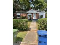 Brick home with well-manicured landscaping at 253 1St Sw St, Atlanta, GA 30314