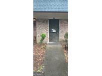 Brick building with a metal security door and a small ramp for accessibility at 91 Peyton Sw Pl, Atlanta, GA 30311