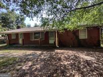 Brick ranch house with a covered porch at 1030 Mundys Mill Rd, Jonesboro, GA 30238